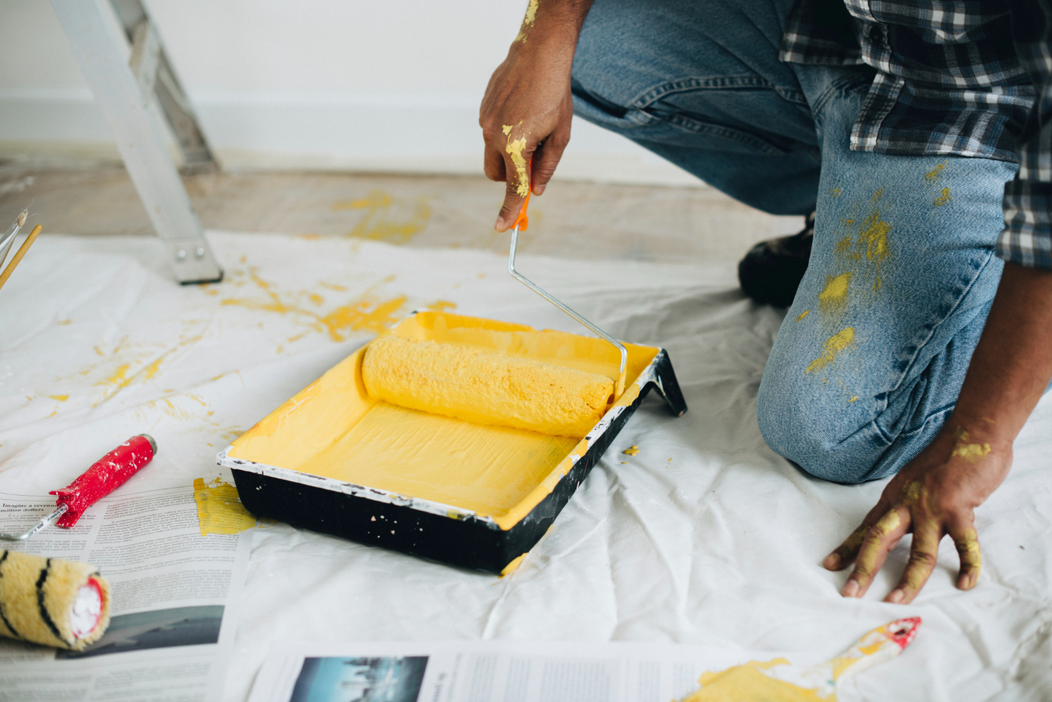 man-painting-walls-yellow